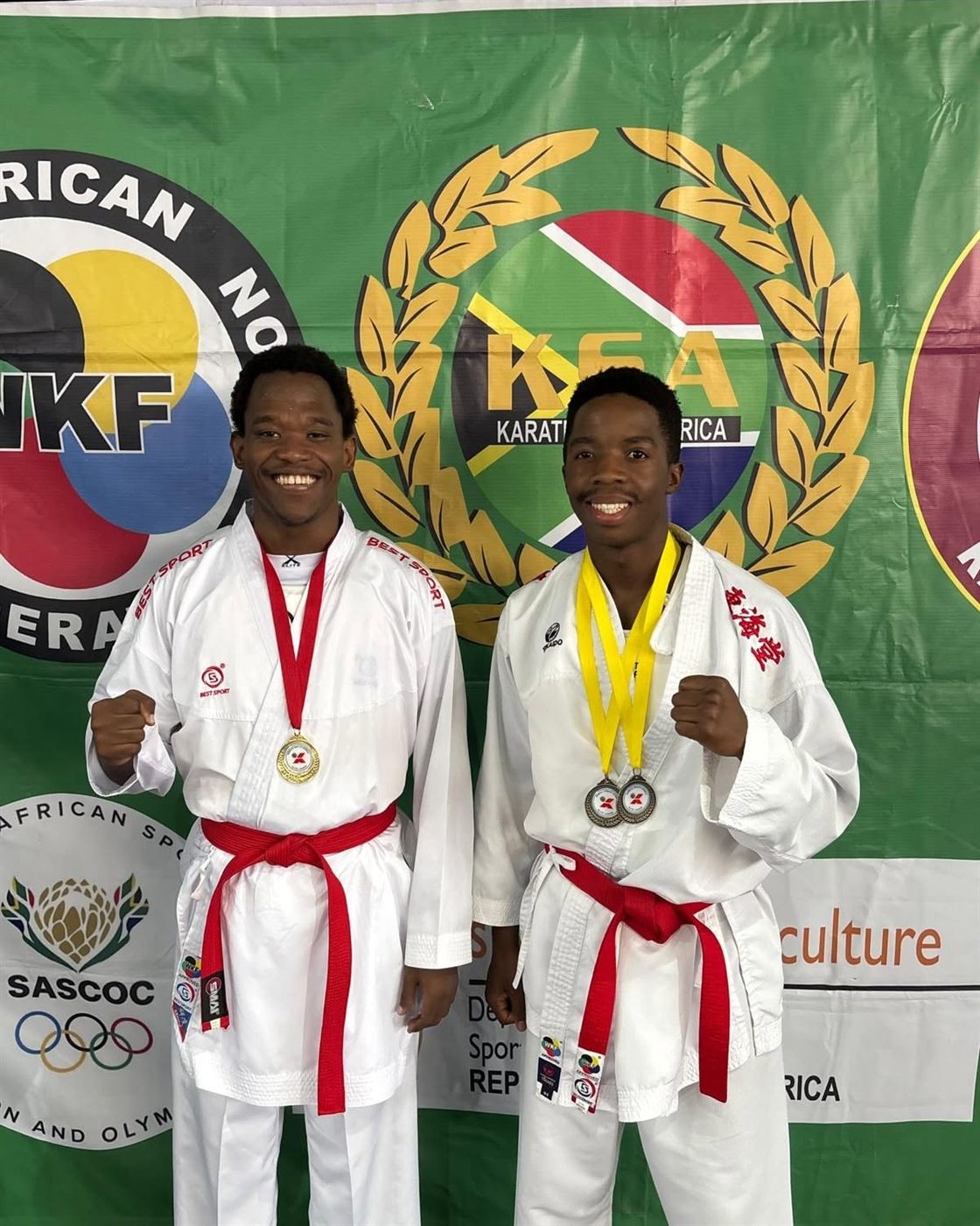 Two KarateZone athletes celebrating their medals